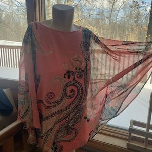 Two flowy tops along with the camisoles underneath.